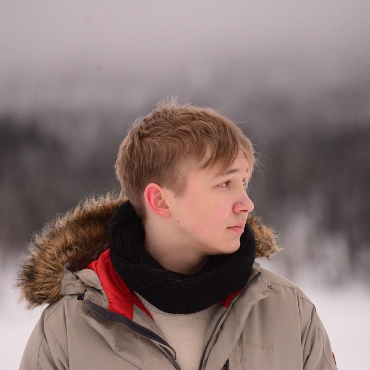 Ava Renner, Lead Design Curator at PineEmporiumHorizon, reviewing corporate floral arrangements